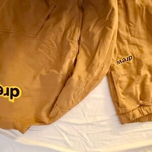 Drew House tan sweatshirt and pants.